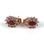 A pair of 9ct gold ruby and diamond cluster stud earrings.