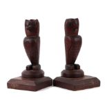 A pair of naïve folk art carved wooden owls, 25cms high.