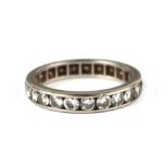 A white metal diamond eternity ring, approx UK size 'I', 3.1g.