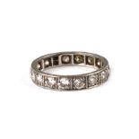 A white metal mounted diamond eternity ring, approx UK size 'F', 2g.