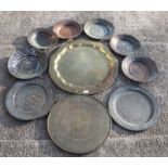 A quantity of Indo-Persian and Middle Eastern trays, the largest 59cms diameter.