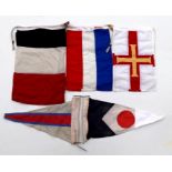 Two yacht pennants and Dutch, French and Guernsey flags.