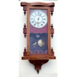 A Victorian inlaid walnut wall clock, the painted dial with Roman numerals.