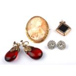 A pair of red amber screw back drop earrings; together with a cameo brooch; a Victorian gold