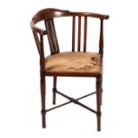 An Edwardian mahogany corner chair with boxwood stringing.