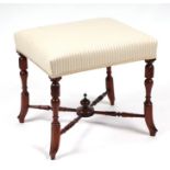 A rosewood stool on turned legs joined by an 'X' stretcher with upholstered seat, 46cms wide.