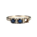A white metal diamond and sapphire ring, approx UK size 'N', 2g.Condition Report Missing one