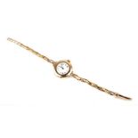 A ladies 15ct gold wristwatch on a 9ct gold strap with later quartz movement, total weight 16.2g.