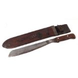 A WWII machete with wooden handle in a leather scabbard, 50cms long.