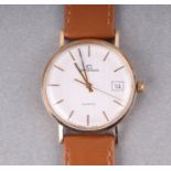 A Garrard 9ct gold gentleman's quartz movement wristwatch, the silvered dial with centre seconds and
