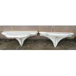 A pair of painted wooden shelves in the George III style, 62cms wide.