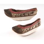 A pair of Chinese silk and bullion wire embroidered shoes