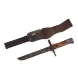 A WW1 trench knife made from a cut down Italian model 1891 knife bayonet in its leather scabbard