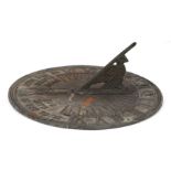 A bronze circular sun dial with motto 'Grow Old Along With Me, The Best Is Yet To Be', 21cms