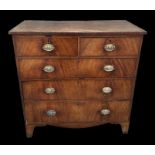 A 19th century mahogany chest of two short and three graduated long drawers above a shaped apron