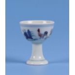 A Chinese Wucai style stem cup decorated with chickens and flowers, six character mark to the