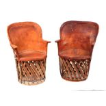 A pair of mid century Mexican Equipale leather and cedar strip woven chairs, 95cms high by 66cms
