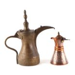 A Turkish / Islamic brass dallah coffee pot, 29cms high; together with a white metal overlaid copper