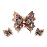 A large silver gilt butterfly brooch set with multi coloured paste stones, 7cms wide; together