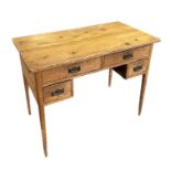 A pine kneehole desk with an arrangement of four drawers, on tapering square legs, 102cms wide.