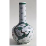 A Chinese famille verte bottle vase decorated with dragons chasing a flaming pearl, blue character