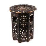 An Islamic / Moorish octagonal side table with bone and mother of pearl inlaid decoration, 34cms