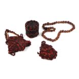 A collection of small tribal items to include a Rudraksha Mala carved bead necklace and seed work