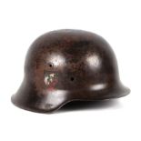 A Nazi German M42 helmet with partial decals. Stamped to the inside of reverse of helmet NS64