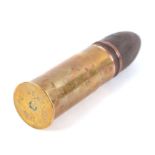 An inert WW1 artillery shell with brass casing in two parts, date stamp to the base for February