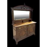 A late 19th century mirrored back oak sideboard with two frieze drawers and cupboards beneath,