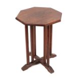 A small octagonal Arts & Crafts oak occasional table, 44cms wide.