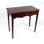 A mahogany side table with single frieze drawer, on square tapering legs, 78cms wide.