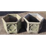 A pair of hexagonal reconstituted stone garden planters, 44cms wide (2).