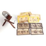 A stereoscopic viewer with various cards depicting views of India, Landscapes and others; together