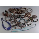 A large quantity of silver and white metal jewellery to include Native American, Mexican and Asian