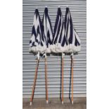 Four Business & Pleasure Company. blue & white stripped premium beach umbrellas & Covers together