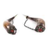 A pair of Scottish wall mounted cow horns with applied white metal Celtic decoration set with a
