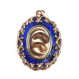 A 19th century blue enamel and hair mourning pendant, 3.5cms diameter (converted from a brooch).