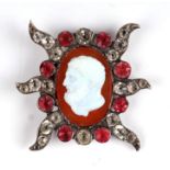 An 18th century paste set brooch with central oval agate cabochon depicting Hercules, 3.5 by 3.