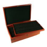 A brass bound coin collector's box with two sectioned lift-out trays, 55cms wide.