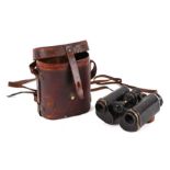 A pair of Triedr Army issue field binoculars, in a leather case.