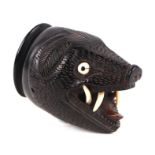An Anglo-Indian hardwood snuff box in the form of a boar's head, 7.5cms high. Self-declaration