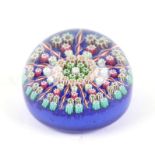 A Perthshire millefiori paperweight with central 'P' cane, 6.5cms diameter.