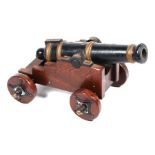 A late 19th century signal cannon. Having a cast iron barrel 49cms (19.25ins) long with an