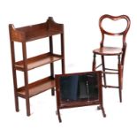 An oak open bookcase, 56cms wide; together with an child's oak correction chair and a toilet mirror,