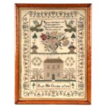 A late Victorian sampler with verse, animals and building within a meandering border, by Ruth