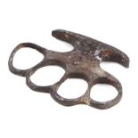 A WWI Military knuckle duster with stamped Crow's Foot and numbered '517', 10cms wide.Condition