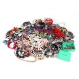 A quantity of costume jewellery to include necklaces and bangles.