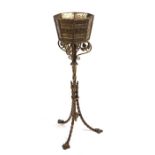 A 19th century Gothic Revival brass planter by Cope & Timmins, 102cms high.