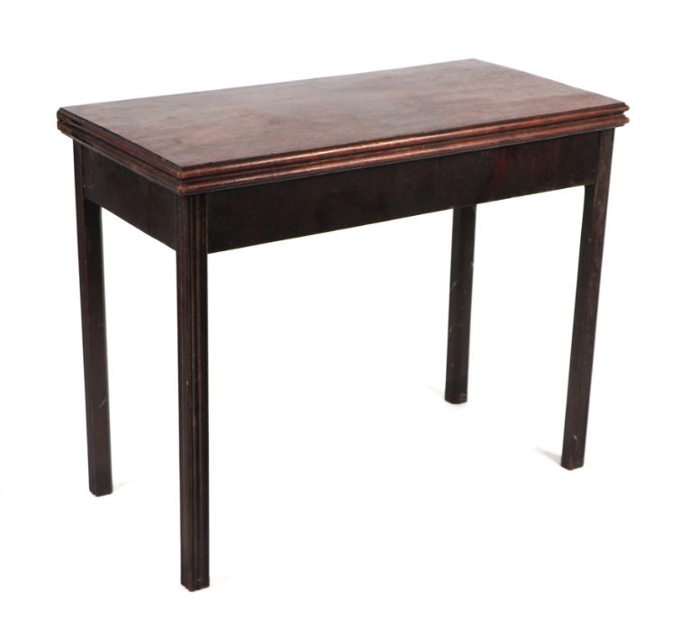 A Georgian mahogany tea table on square reeded chamfered legs, 91cms wide.